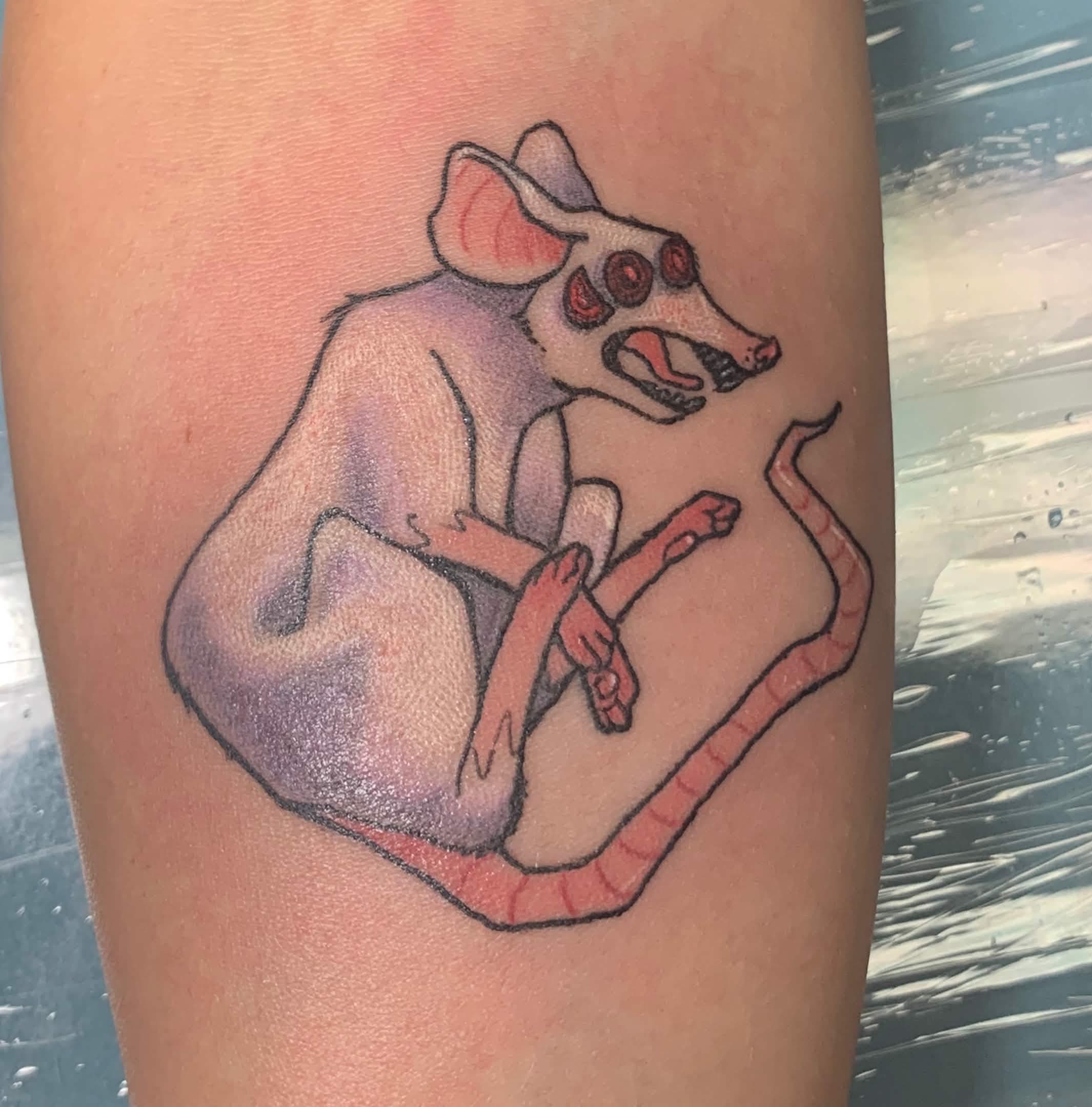 tattoo of a white rat with three red eyes and an open mouth of sharp teeth